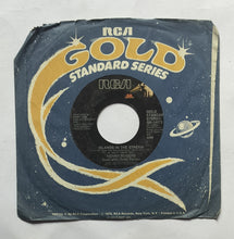 Kenny Rogers " EP, 45 RPM "       Side A : Islands In The Stream , Side B : Eyes That See In The Dark .