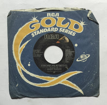 Kenny Rogers " EP, 45 RPM "       Side A : Islands In The Stream , Side B : Eyes That See In The Dark .
